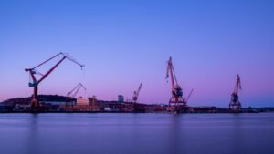 crane near body of water during daytime